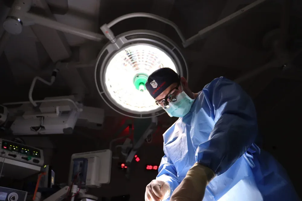 Dr. Tyler Okland performing facial plastic surgery
